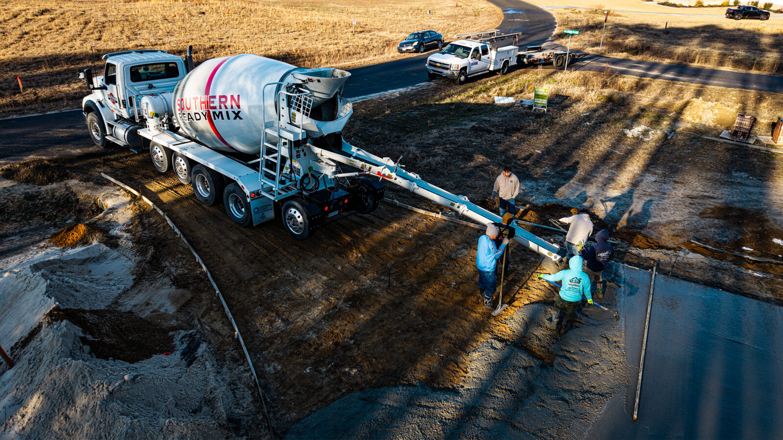 Aerial view of SRM mixer delivering concrete on residential job site